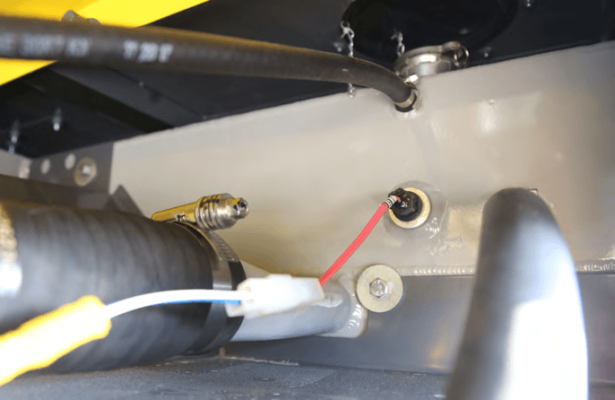Integrated top tank to reduce leak risk and avoid corrosion